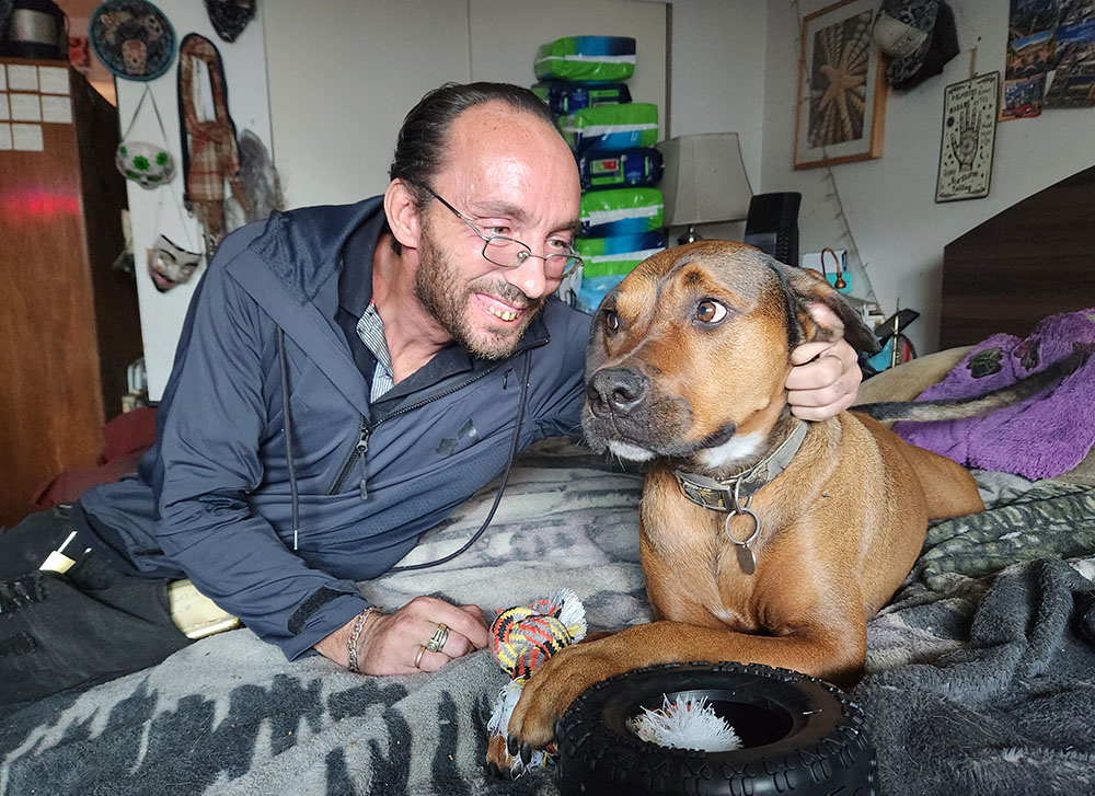 Tommy Dunphy says watching after his beloved dog, Arianna, has helped anchor his life for about six years. (GSR photo/Chris Herlinger)