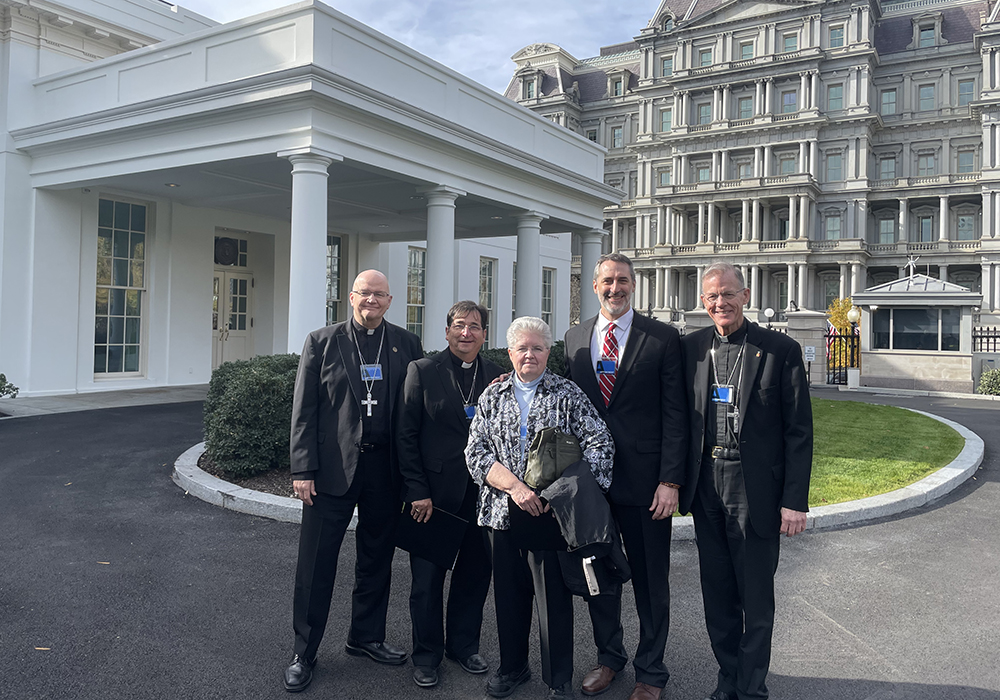 Bishop Edward Weisenburger (Diocese of Tucson), Bishop Joseph Tyson (Diocese of Yakima), St. Joseph Sr. Carol Zinn (executive director of the Leadership Conference of Women Religious), Lonnie Ellis (executive director of In Solidarity), and Archbishop John Wester (Archdiocese of Santa Fe) outside the White House for a meeting about climate change on Nov. 17. (Courtesy of In Solidarity)