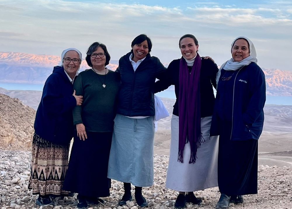 Sr. Julia Hurtado (second from left) poses with Camboni Srs. Expedita Pérez Leon, Lourdes (Lulu) Garcia Grande, Lorena Sesatty Saenz and Cecilia Sierra Salcido on El Montar, the highest hill, with the Dead Sea in the background. The Bedouins guided the group to this scenic spot during their journey." (Courtesy of Julia Hurtado)