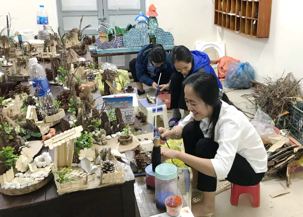 Daughters of Our Lady of the Visitation Sr. Mary Agnes Truong Thi Phuc (in white) and two other sisters make crèches from old items at their convent in Thua Thien Hue province on Dec. 5 to sell and offer food to people in need. (Joachim Pham)