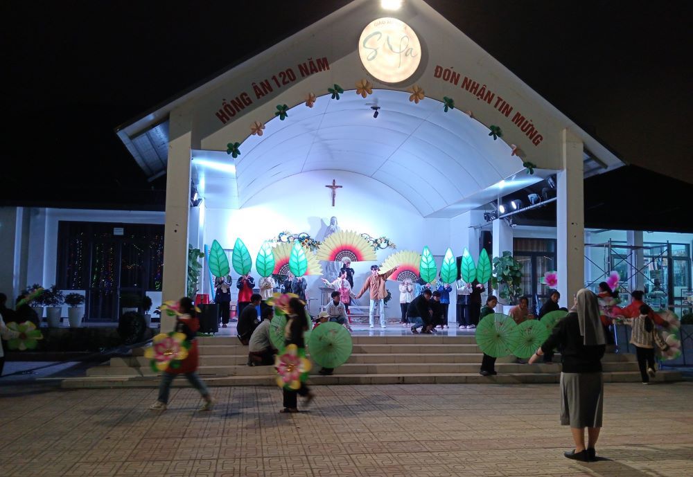 St. Paul de Chartres Sr. Maria Nguyen Thi Su teaches Hmong students from a church-run hostel to practice nativity plays at night at Sa Pa Church. They plan to perform the plays and sing carols at Christmas Eve celebrations. (Joachim Pham)