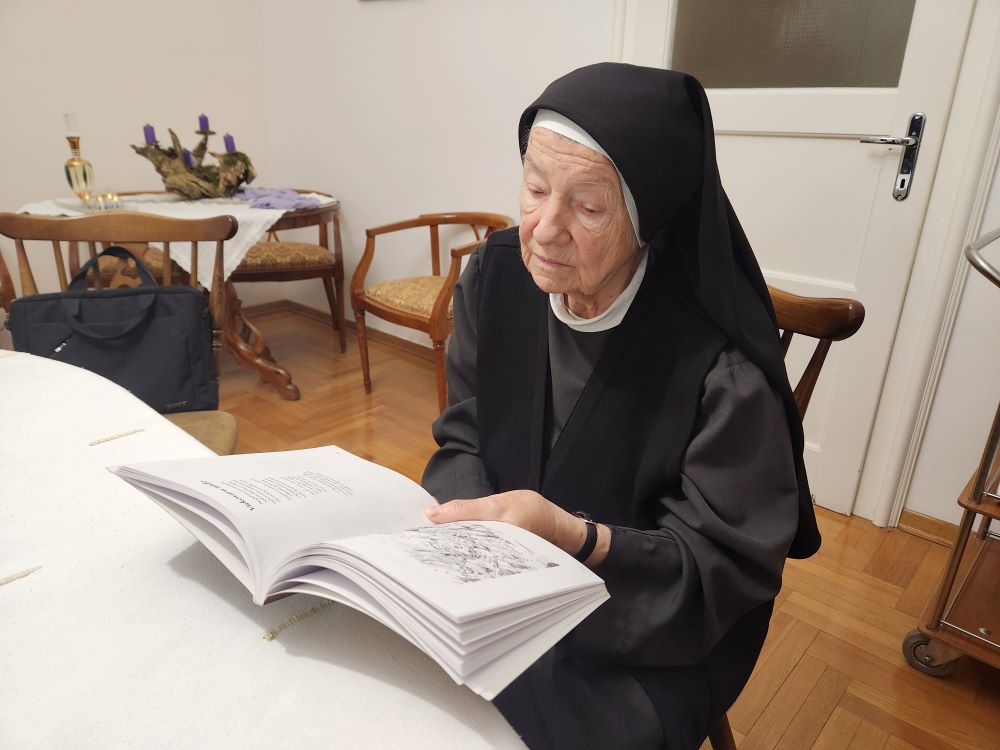 Sr. Damira Biškup, a member of the Sisters of Mercy of the Holy Cross, served 25 years at the maternal wing of Vukovar hospital, and stayed there through Vukovar's fall in 1991. She reads from a book of poetry published in 2019 that focuses on the Croatian War of Independence. (GSR Photo/Chris Herlinger)