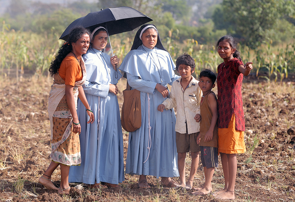 A still from the movie "The Face of the Faceless," where Sr. Rani Maria, a Franciscan Clarist nun (played by Vincy Aloshious), encounters exploitation and oppression of low-caste landless laborers in central India (Courtesy of Shaison P. Ouseph)