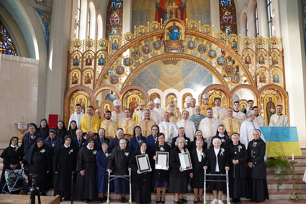Metropolitan Archbishop Borys Gudziak of the Ukrainian Catholic Archeparchy of Philadelphia, center back, poses with other clergy and women religious in a group shot after he presented the 2023 Metropolitan Service Award
