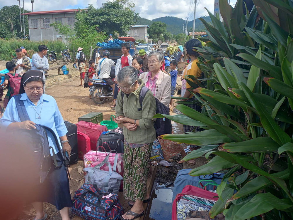 Catholic sisters and others in Loikaw, Myanmar, prepare to leave as the fighting becomes more intense in November. (Courtesy of Sister Florence)