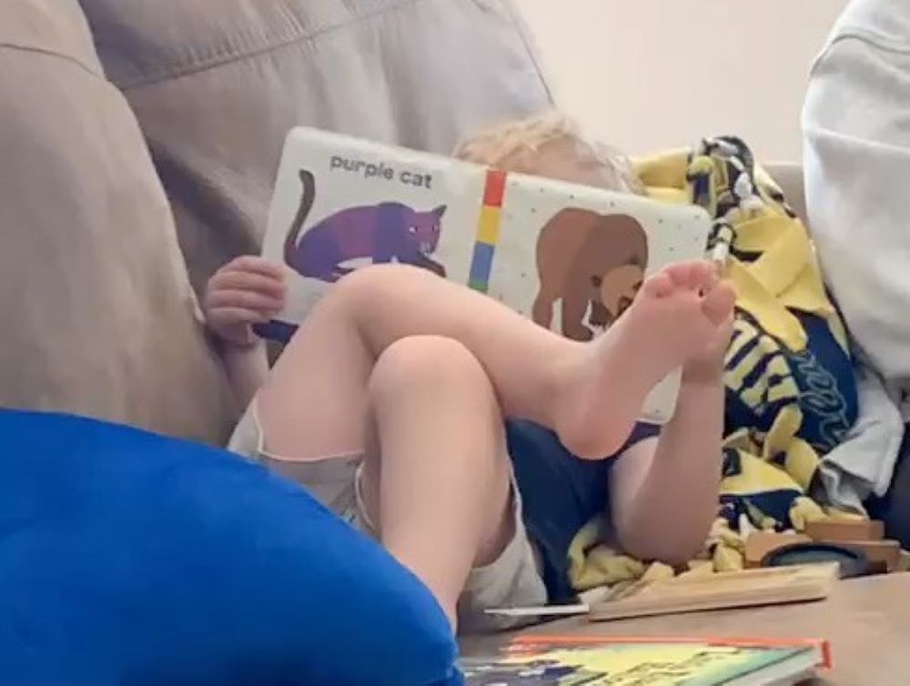  Humility of Mary Sr. Margaret Cessna's 4-year-old nephew Barrett, reads a book.