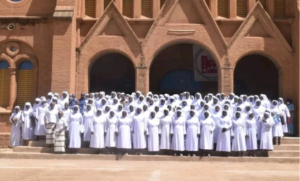 Sisters of the Immaculate Conception of Ouagadougou gather in front of Ouagadougou Cathedral in Ouagadougou, Burkina Faso, at the official opening of the congregation's jubilee in 2021.