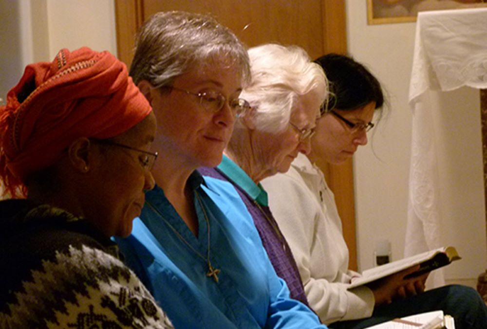 Dominican Sister of Peace June Fitzgerald, second from left, prays with other sisters in this undated photo.