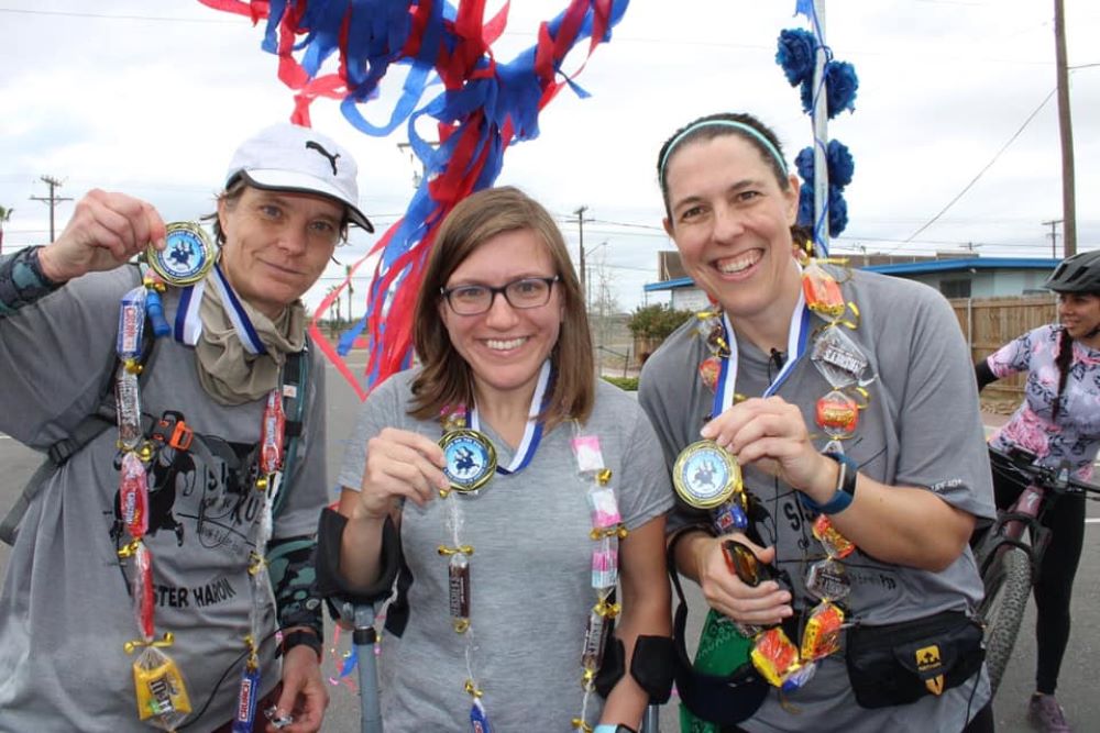 Showing off their medals at the end of the 2021 Sisters on the Run fundraiser are, from left,  Sr. Sharon Horace, Alex Vizard and Sr. Liz Sjoberg. (Courtesy of Proyecto Juan Diego)