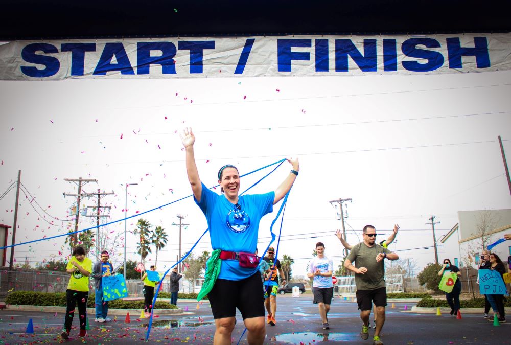 Daughter of Charity Sr. Elizabeth Sjobert crosses the finish line at the Sisters on the Run marathon on Jan. 28, 2023. She founded Sisters on the Run, which raises money for Proyecto Juan Diego, a mission serving low-income Hispanic families in Brownsville, Texas. 