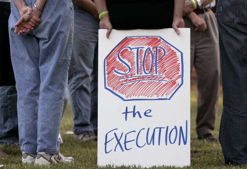 Protesters opposed to the death penalty demonstrate outside a Georgia state prison for men in Jackson in this 2008 file photo.