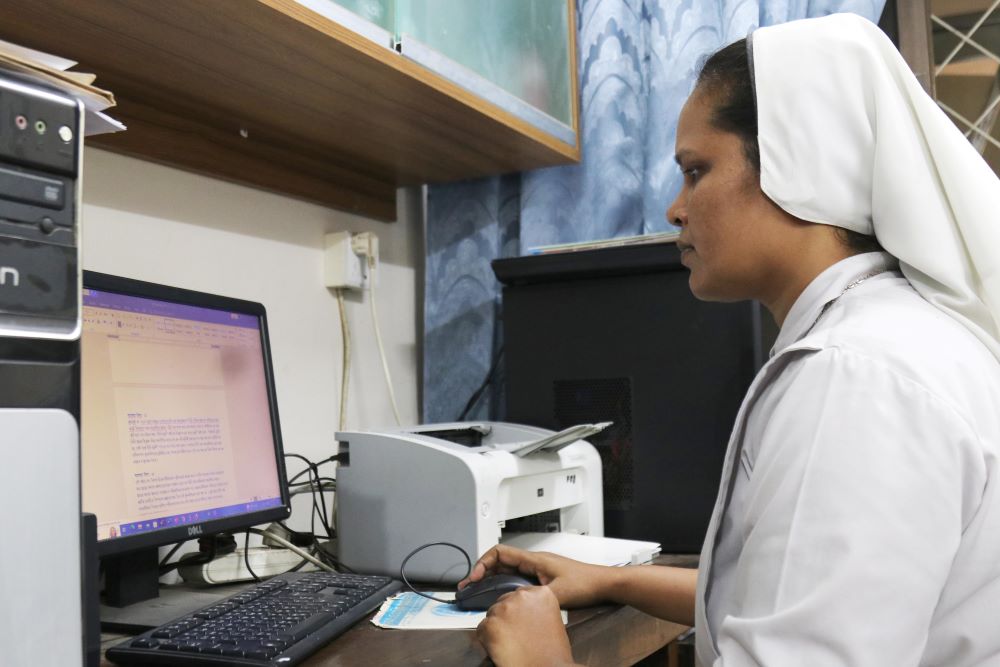 Sr. Champa Adline Rozario works in her youth commission office in the Catholic Bishops' Conference Center in Dhaka, Bangladesh.