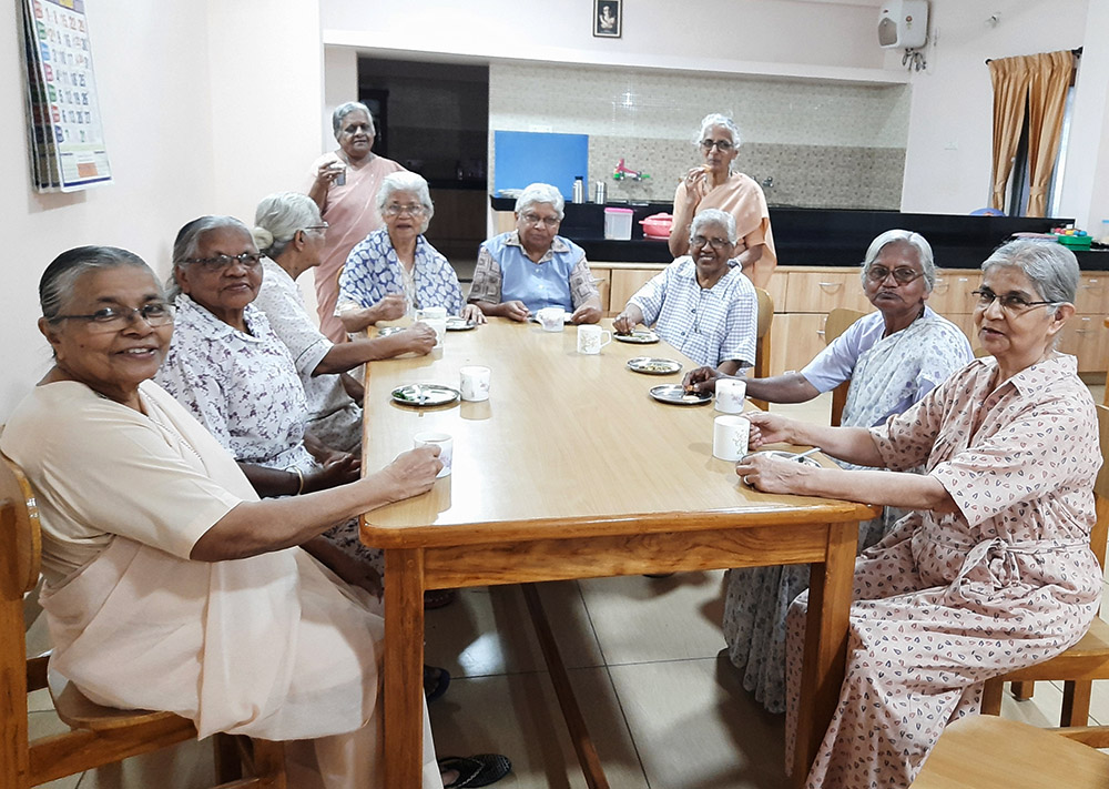 Sr. Anne Mathew, right, has evening tea with other residents of Neya Deepam, a home for aged nuns of the Franciscan Missionaries of Mary in the outskirts of Coimbatore, a major town in Tamil Nadu state in southern India. (Saji Thomas)
