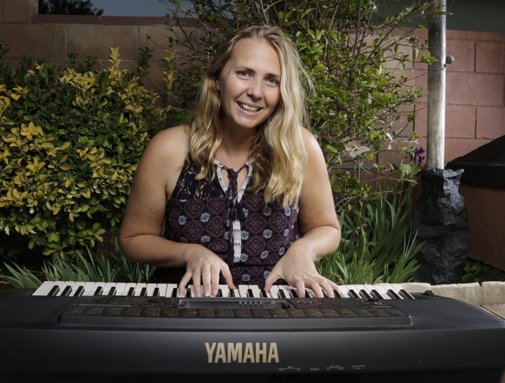 Josephite Sr. Sally Koch plays piano. 