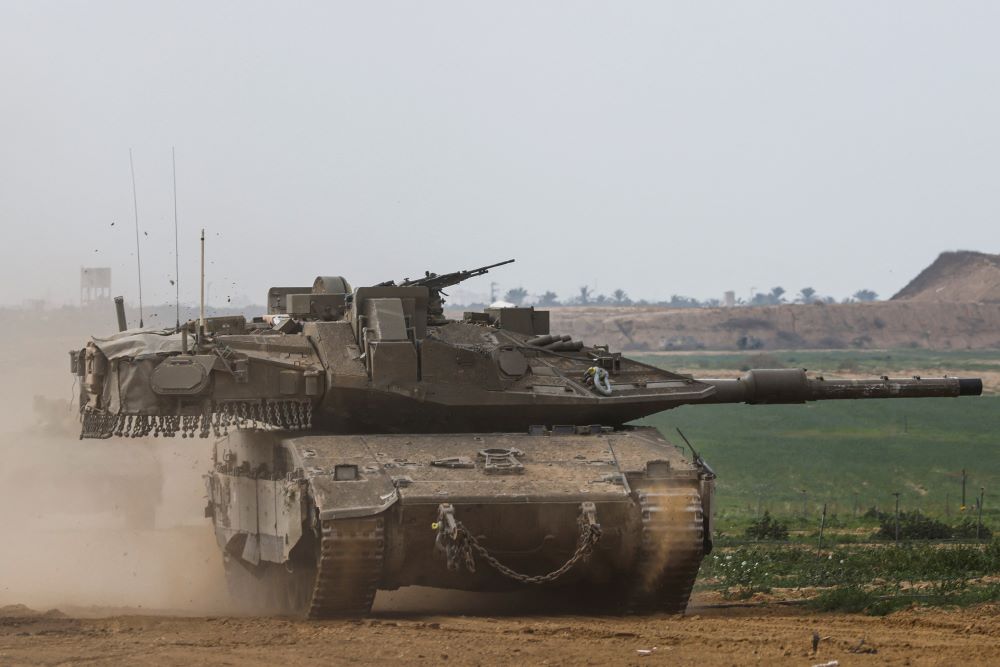 An Israeli tank reenters Israel from Gaza near the Israel-Gaza border in southern Israel Jan. 11, 2024, amid the ongoing conflict between Israel and the Palestinian Islamist group Hamas. 
