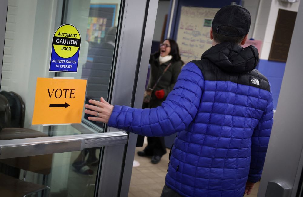 Voters arrive to cast ballots at the Webster School in Manchester, New Hampshire, shortly after polls opened in the New Hampshire presidential primary election Jan. 23. (OSV News/Reuters/Mike Segar)