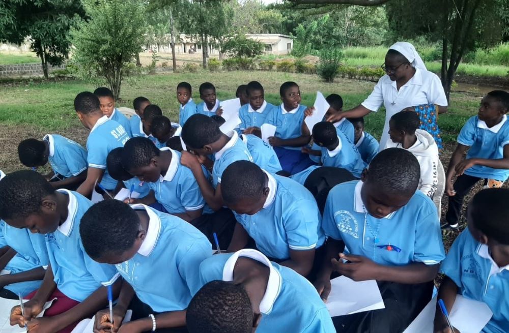 Students take exams outdoors at St. Mary's Comprehensive High School in Ndop, located in the central northwest region of Cameroon.