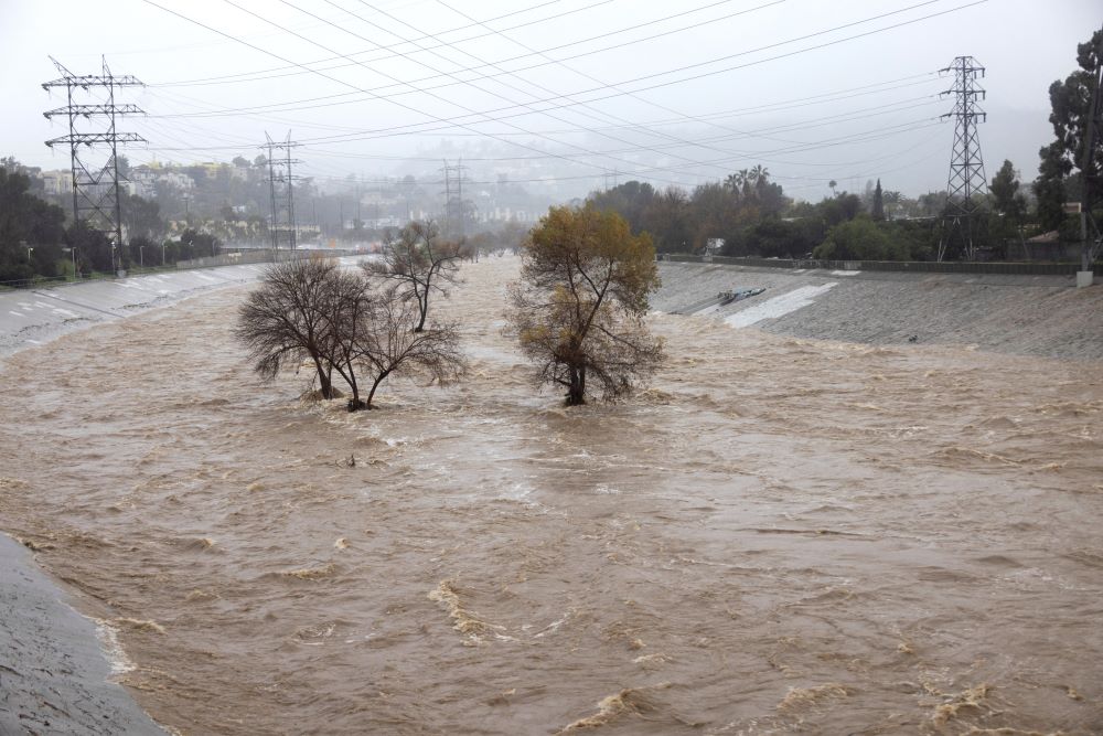 The Los Angeles River in Studio City, Calif., Feb. 5, 2024, is pictured during heavy rains. One of the wettest storms in Southern California history unleashed at least 475 mudslides in the Los Angeles area after dumping more than half the amount of rainfall the city typically gets in a season in just two days, and officials warned Feb. 6 that the threat was not over yet. (OSV News photo/Aude Guerrucci, Reuters)