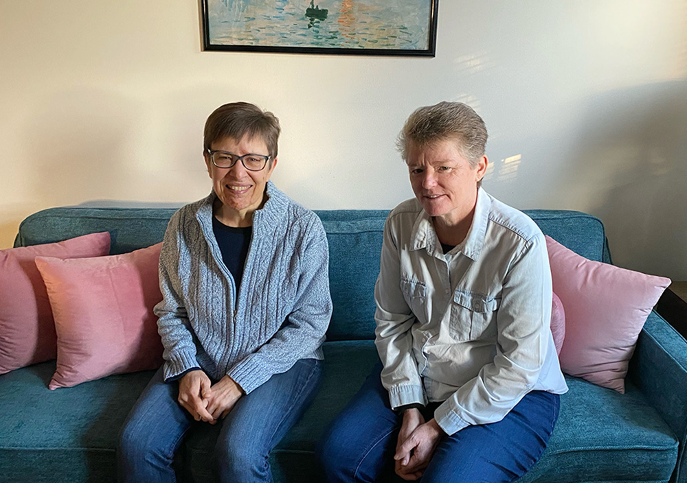 Srs. Claudia Stecker, left, and Kate O'Neill, members of the congregation of Our Lady of the Missions, serve as volunteers in one of LifeWay Network's safe houses. Here, they wear blue in recognition of January as human trafficking awareness month. (Courtesy of LifeWay Network)