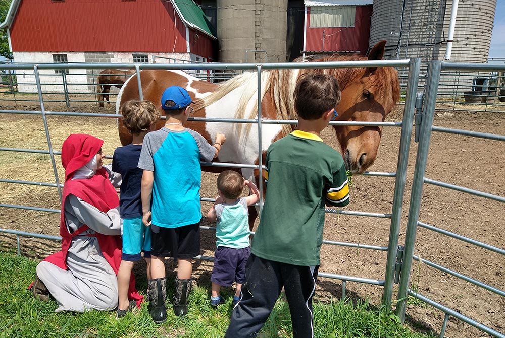 Children visit the Merciful Heart of Jesus Farm outside Marshfield, Wisconsin. The Franciscan Association of Divine Mercy formally organized in 2019, after Mother Mary Veronica Fitch received permission to pursue the new community. (Courtesy of Mary Veronica Fitch)