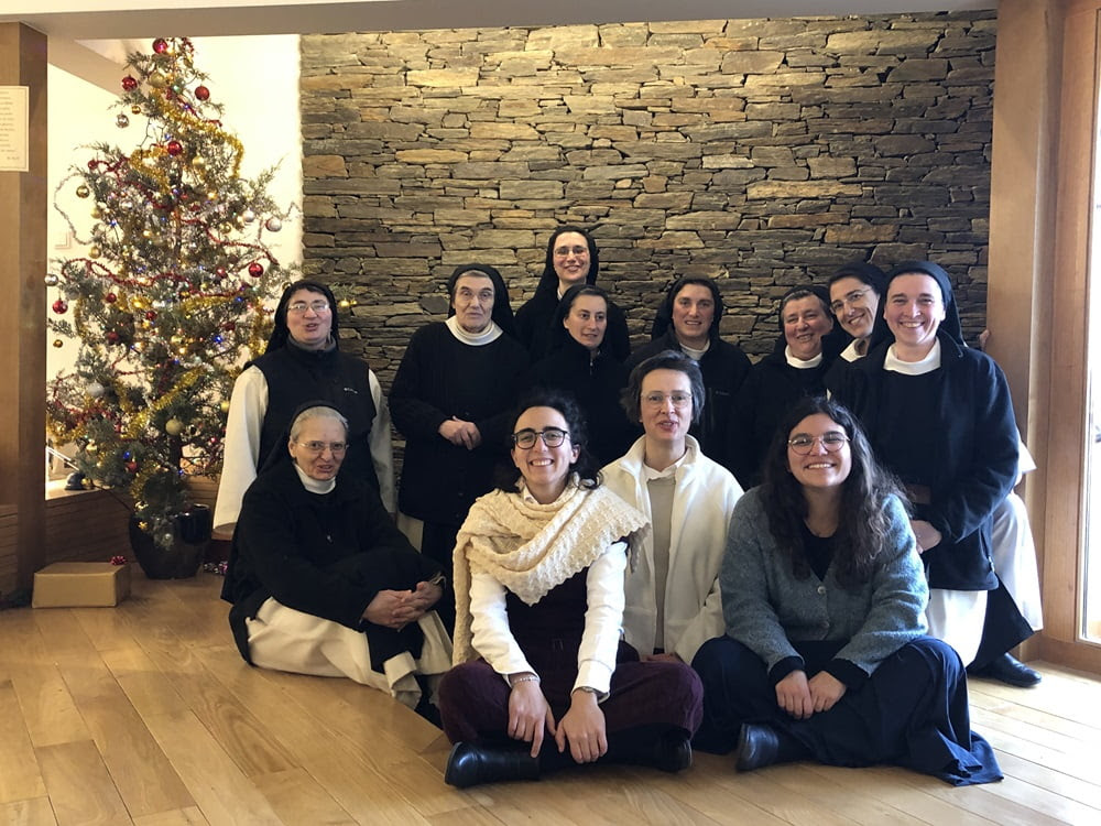 In the space that has now burned down, the nuns and postulants of the Trappist Monastery of St. Mary Mother of the Church in Palaçoulo, Portugal, celebrate Christmas 2023. (Courtesy of Trappist Monastery of St. Mary Mother of the Church)