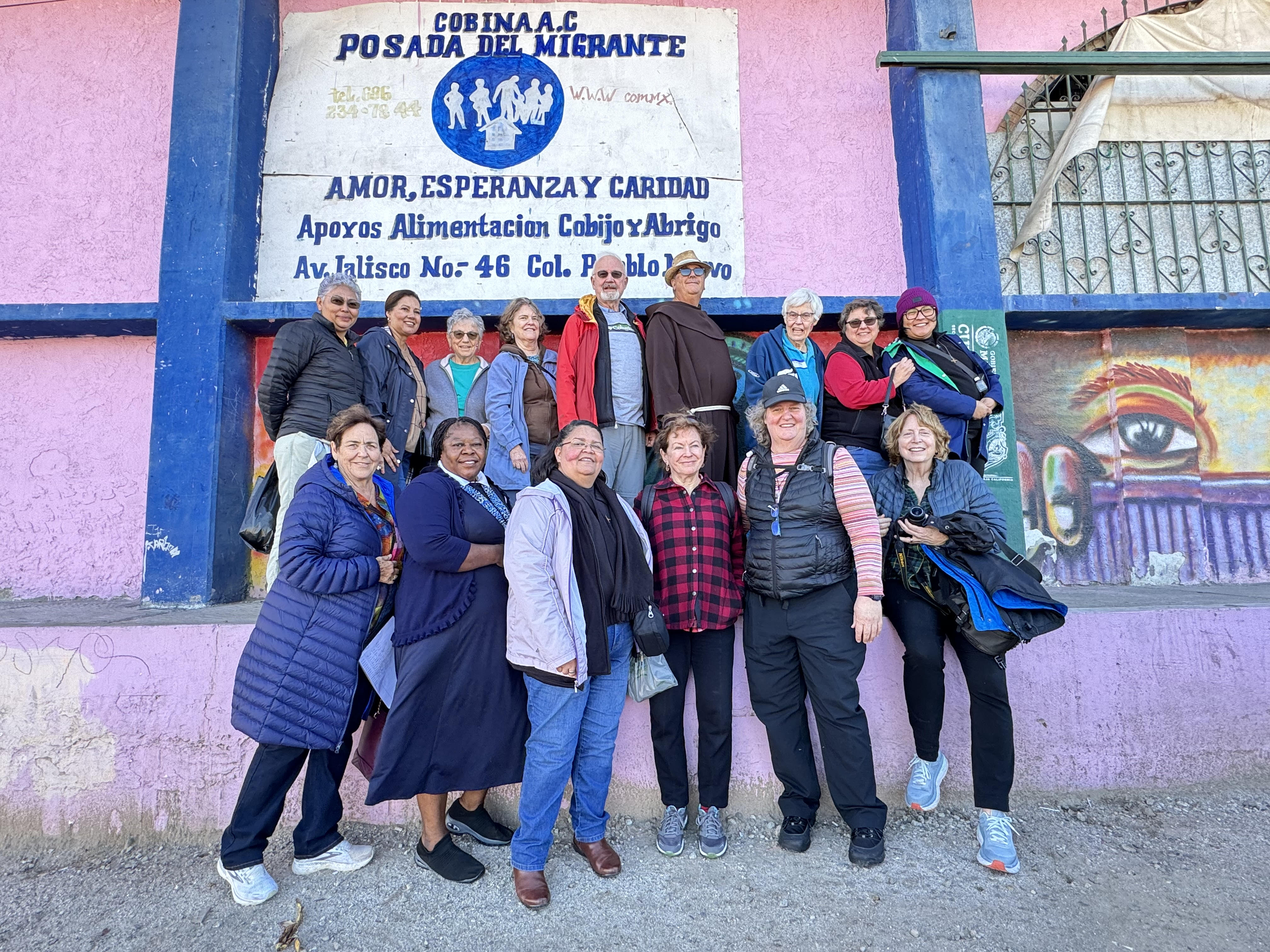 A group of women and men religious and collaborators pose for a group photo outside the Cobina Posada del Migrante Shelter in Mexicali, Mexico, Feb. 8 after a visit to the U.S.-Mexico border. They were part of a group that participated in a five-day pilgrimage to discern how religious communities can respond at the southern border. (GSR photo/Rhina Guidos) 