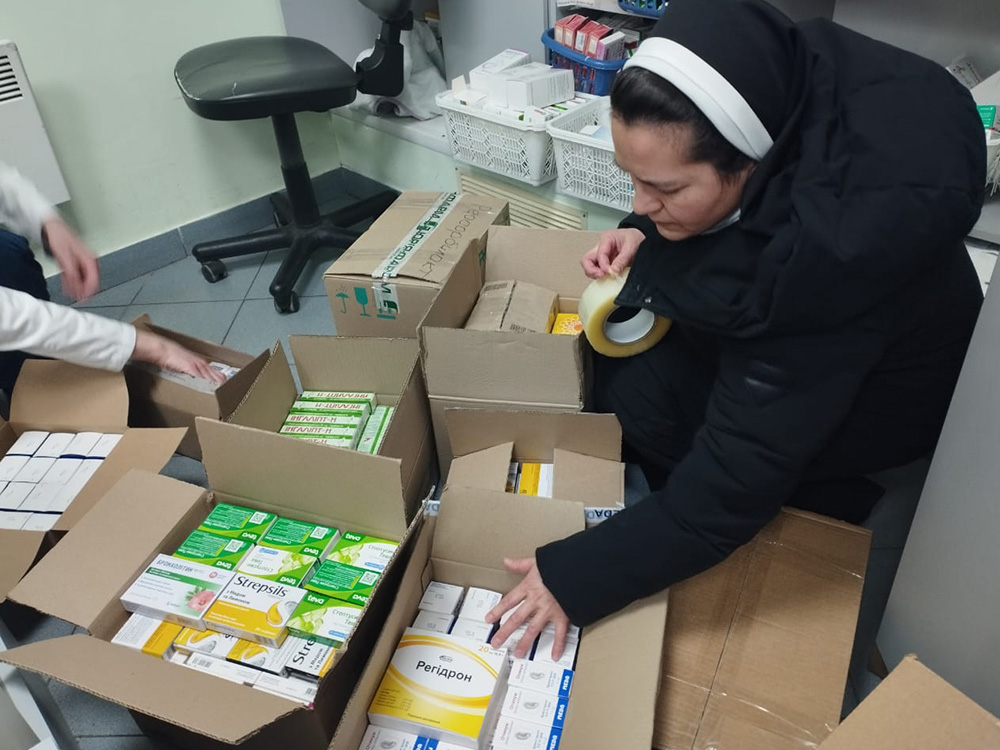 Sr. Yanuariya Isyk, a member of the Order of St. Basil the Great, checks on supplies headed for children and soldiers in war-torn sections of Ukraine as part of a volunteer effort she coordinates. (Courtesy of Yanuariya Isyk)