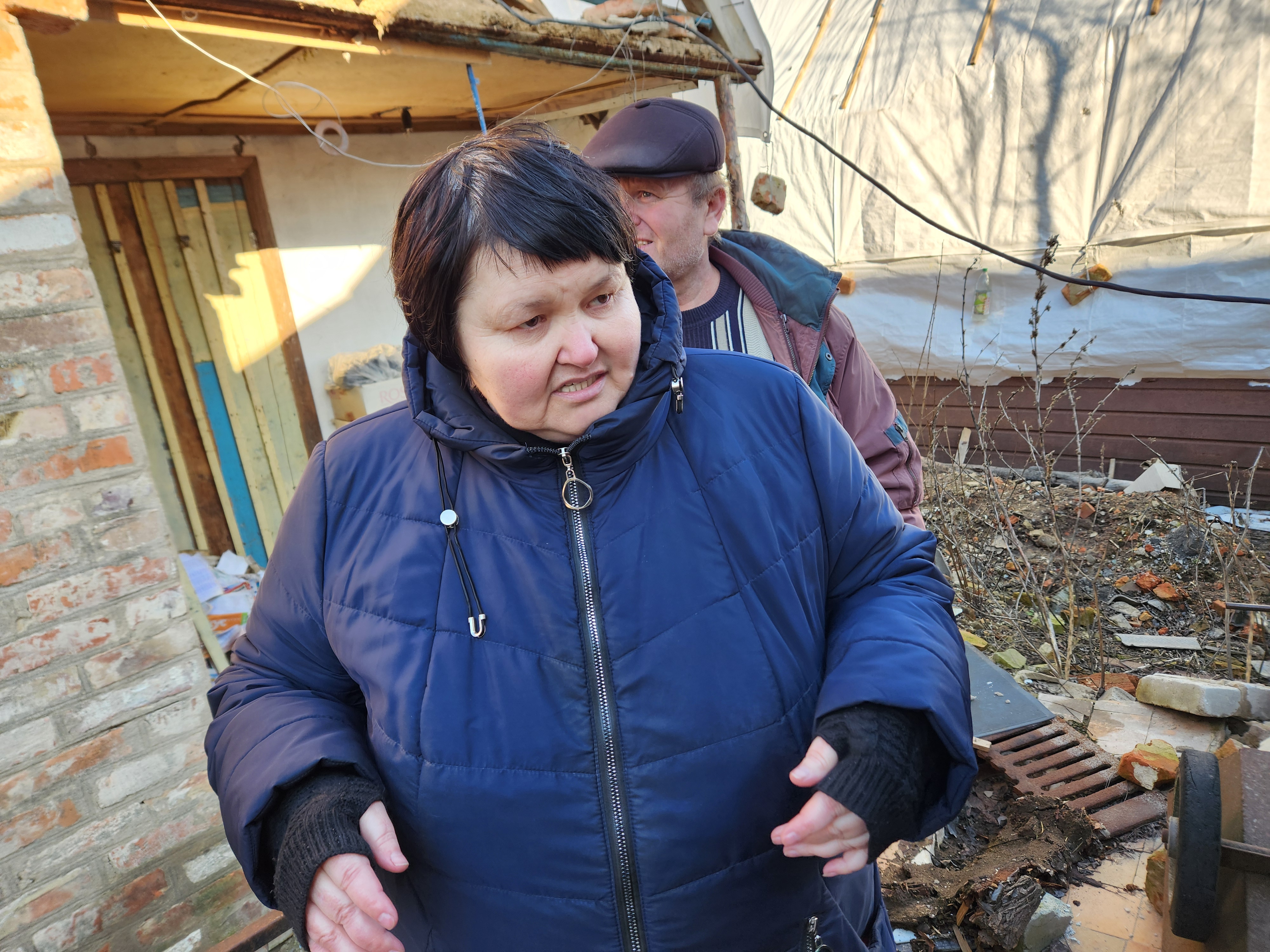 Inna Sirinok, and her husband, Yurii, survey their destroyed home in the eastern Ukrainian village of Preobrazhenka "We honestly don't have the strength to recover," Sirinok said, so considerable is the amount of damage to the house. "We have to start over," added Yurii, 55. "We don't have the strength. We're elderly." (GSR photo/Chris Herlinger)