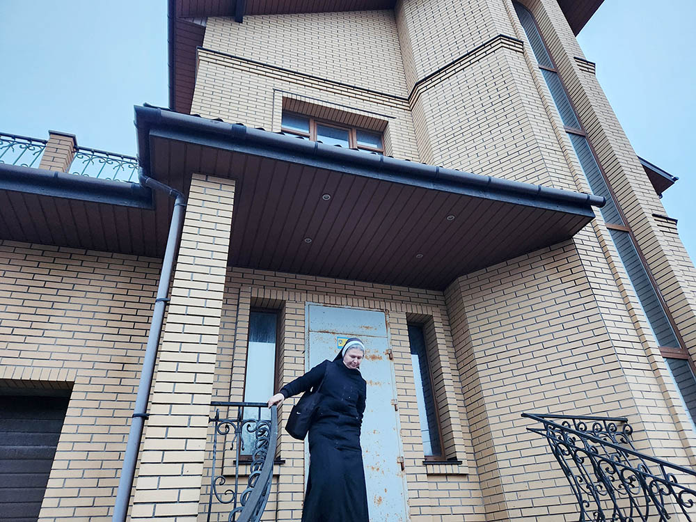 The Order of St. Basil the Great recently purchased this three-story residence in northwest Kyiv, Ukraine, in hopes of turning it into a monastery for the sisters, but also a rehabilitation center for the wounded, a center for soldiers and their families, especially children. In front of the residence is Superior Sr. Magdalyna Vytvytska. (GSR photo/Chris Herlinger)