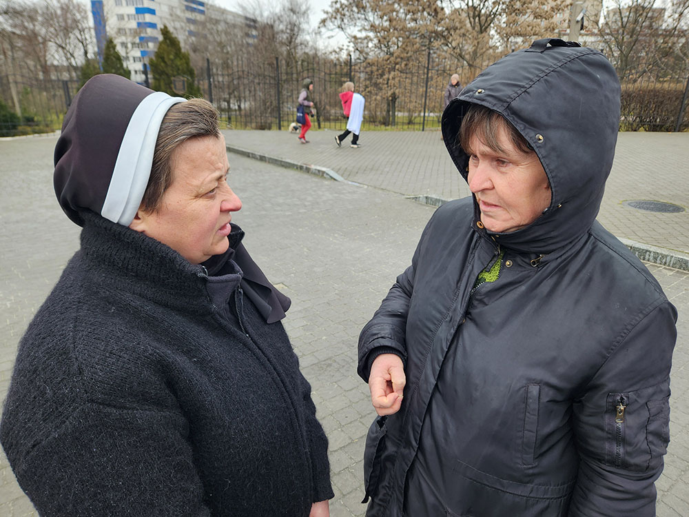 Sr. Lucia Murashko, 49, left, with Diakova Lubov, in Zaporizhzhia, Ukraine, displaced from a village south of the city (GSR photo/Chris Herlinger)