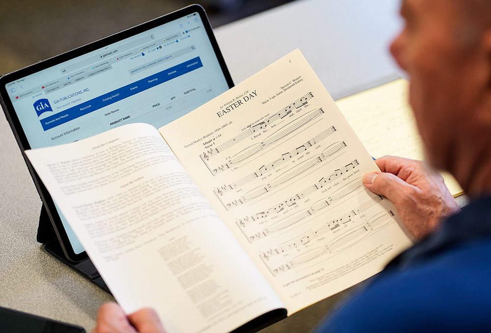 A participant looks at a booklet while attending a workshop on Irish sacred music during the Liturgical Music Institute at Immaculate Conception Seminary in Huntington, New York, Aug. 1, 2023. (OSV News/Gregory A. Shemitz)