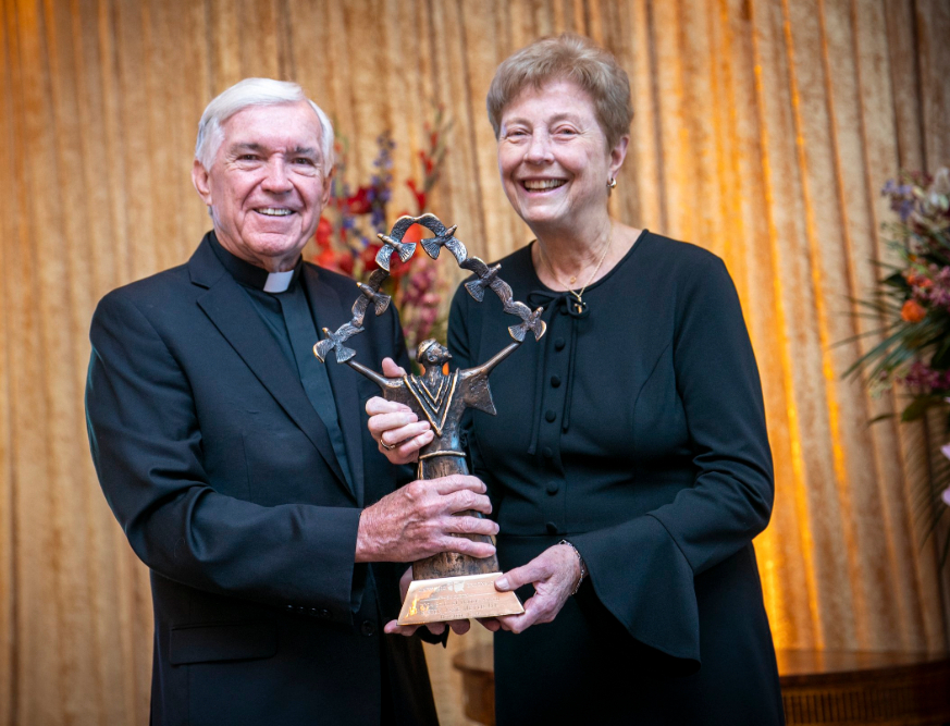 Father Jack Wall, president of Catholic Extension, poses with Dominican Sister Jane Meyer Feb. 15, 2024, after he presented her with Extension's seventh annual Houston Spirit of Francis Award for her decades of commitment to Catholic education and promotion of social justice.