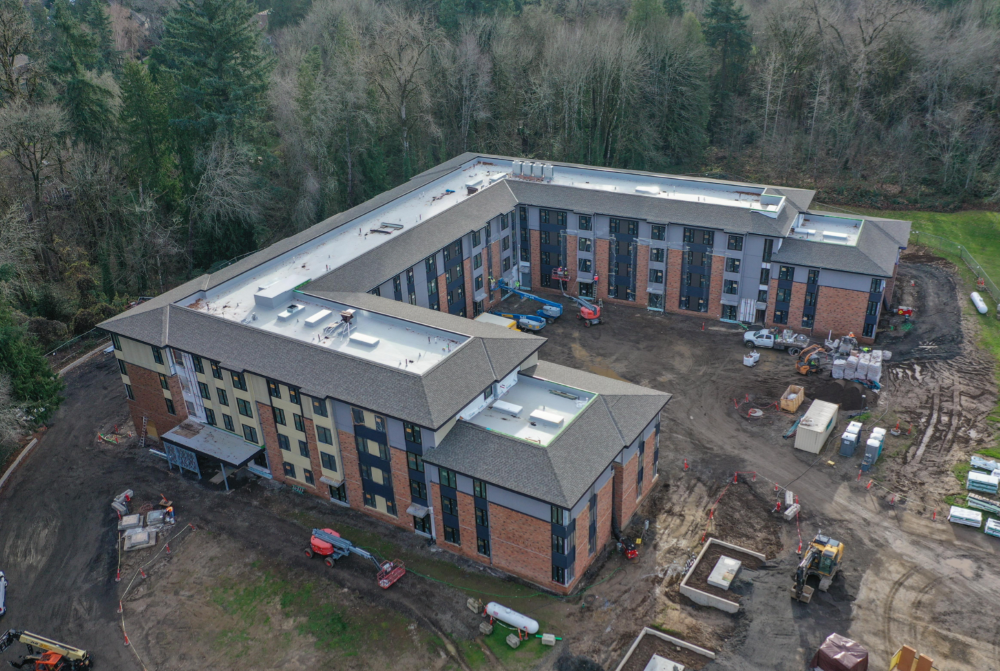 The Mercy Greenbrae project can be seen under construction on the campus of the former Marylhurst University. Through a partnership of the Sisters of the Holy Names of Jesus and Mary and Mercy Housing, 100 units of affordable housing are being built where two college dorms once stood.