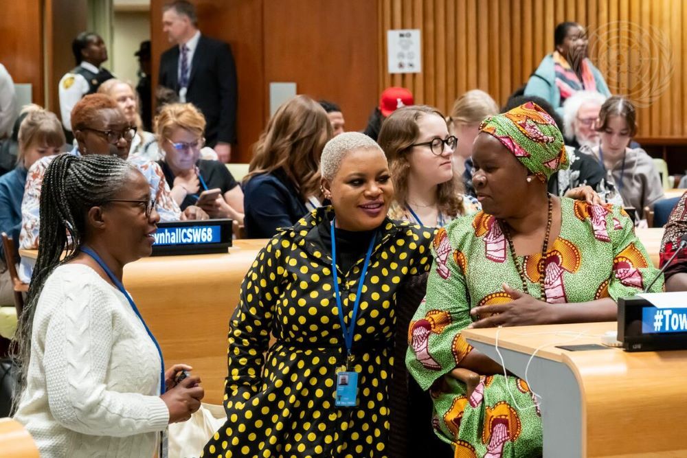 People mingle at UN town hall meeting.