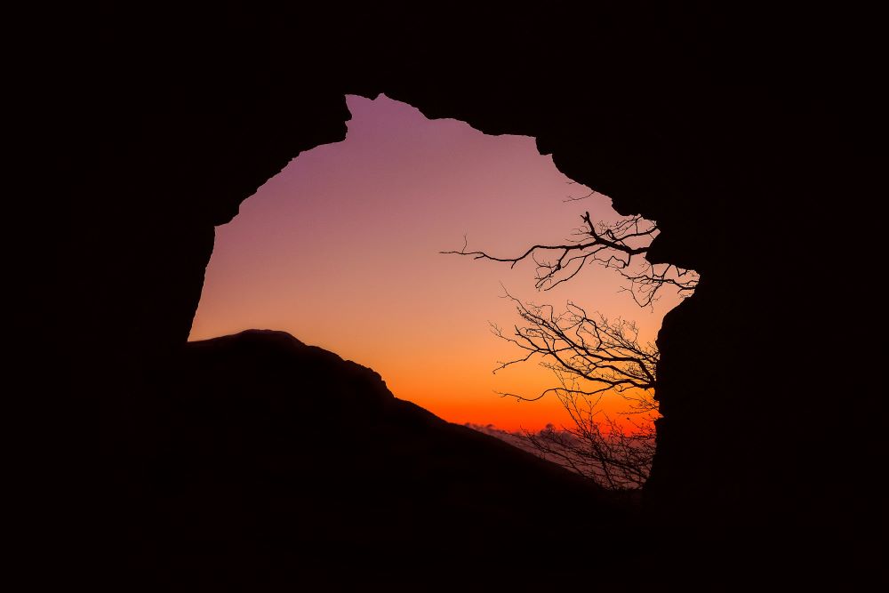 sky seen through cave opening