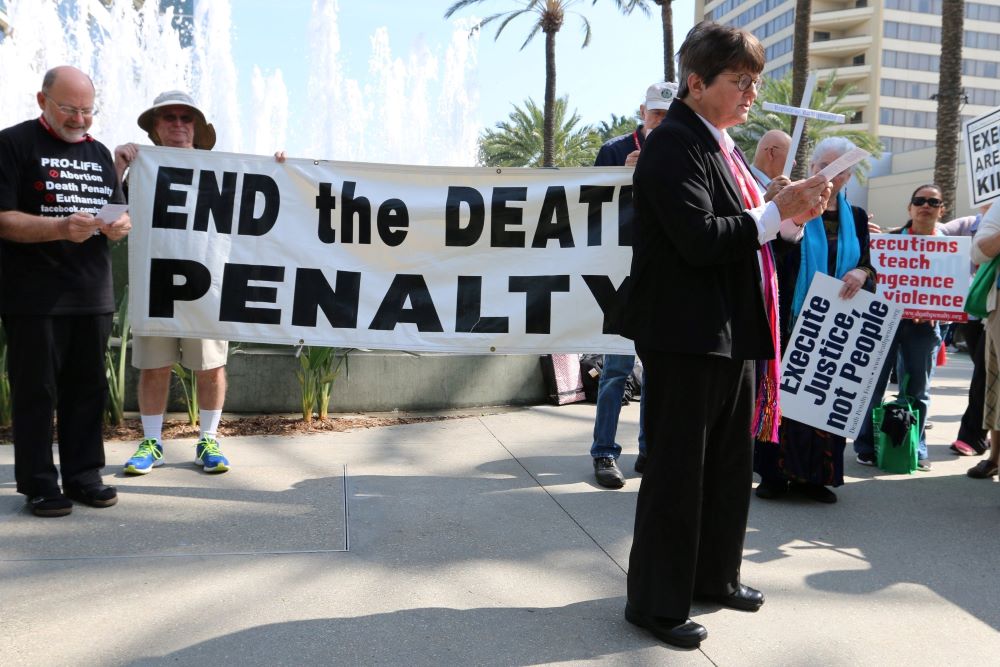 St. Joseph Sr. Helen Prejean speaks in front of a banner that reads, "End the death penalty."