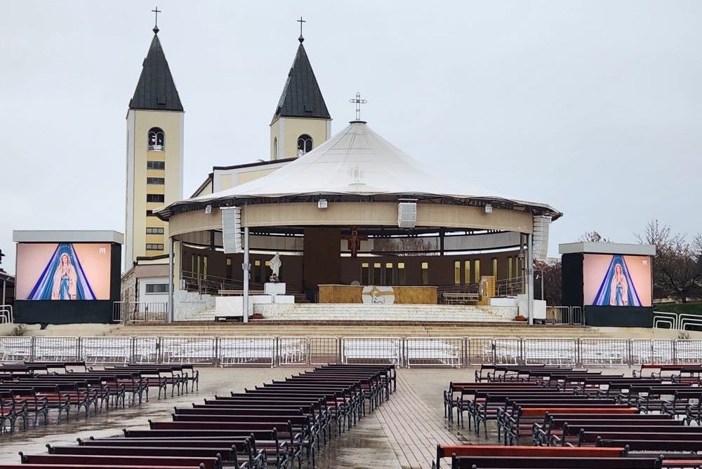 The Marian shrine in Medjugorje includes an outdoor stage and benches.