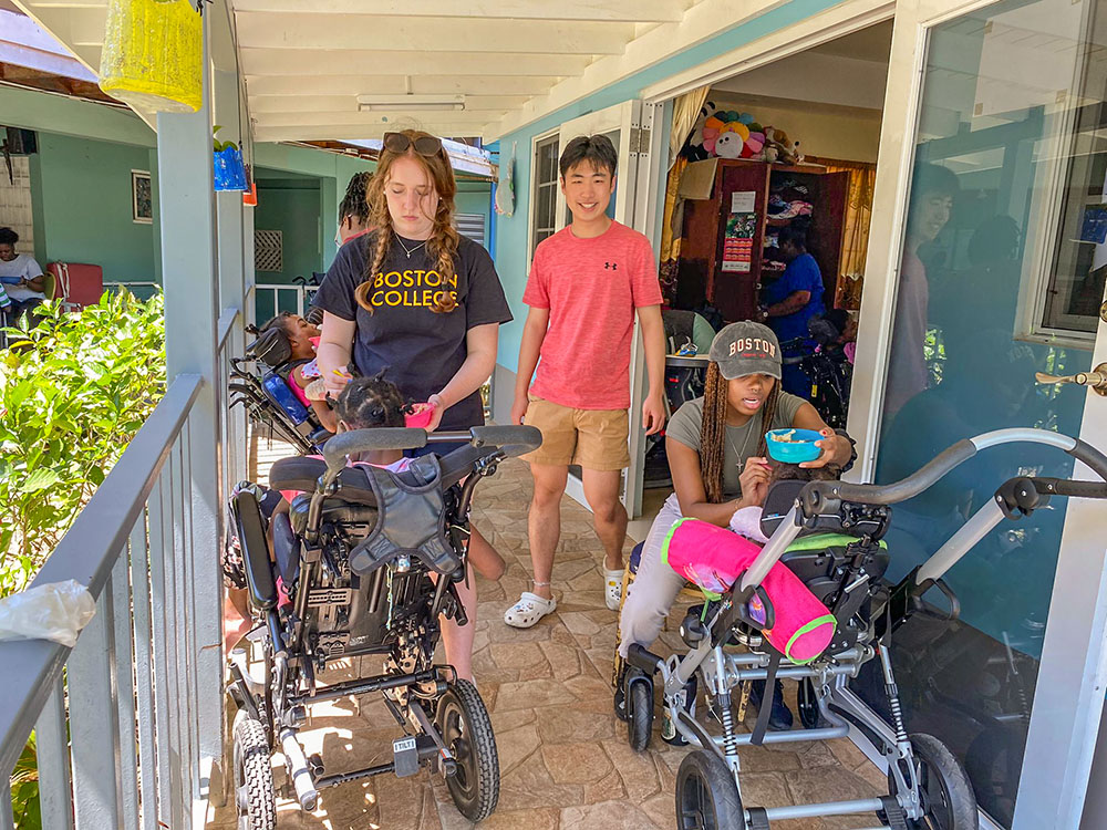 Volunteers provide nourishment and care to residents in need at Jamaica Mustard Seed in Kingston, Jamaica. (Ana González)