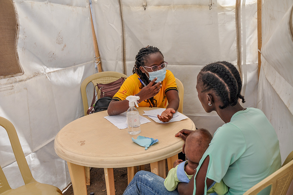 Dr. Susan Navucha, a medical officer at the DREAM Center in Lang'ata, Nairobi, Kenya, meets a client on Dec. 1, 2023. (Lourine Oluoch)