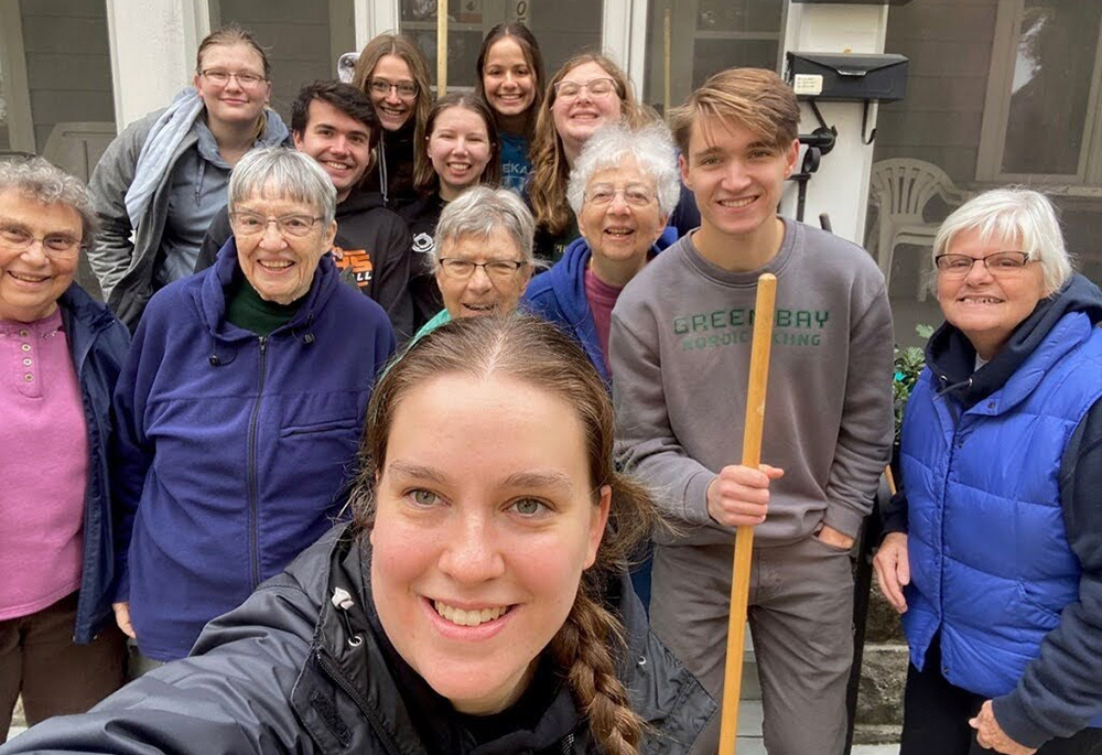 Sr. Laura Zelten, far right, smiles with her students at the University of Wisconsin-Green Bay in Green Bay, Wisconsin, during a community service event. (Courtesy of Laura Zelten)
