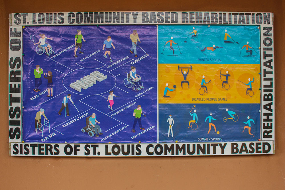 A banner showing all forms of disabilities and their sports adorns a wall outside the office of one of the sisters. (GSR photo/Valentine Benjamin)