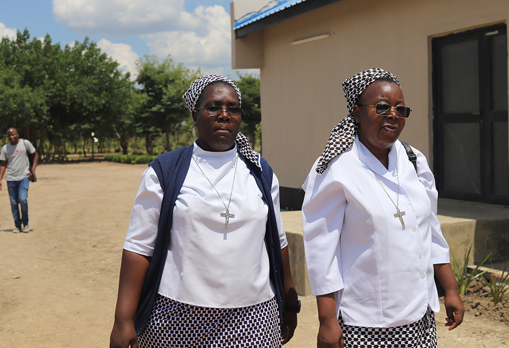 Srs. Christine Mubanga (left) and Matilda Mubanga, both members of the Daughters of the Redeemer congregation, on their way to donate food boxes to the villages in Chibombo, a town in the central region of Zambia on March 11. (Doreen Ajiambo)
