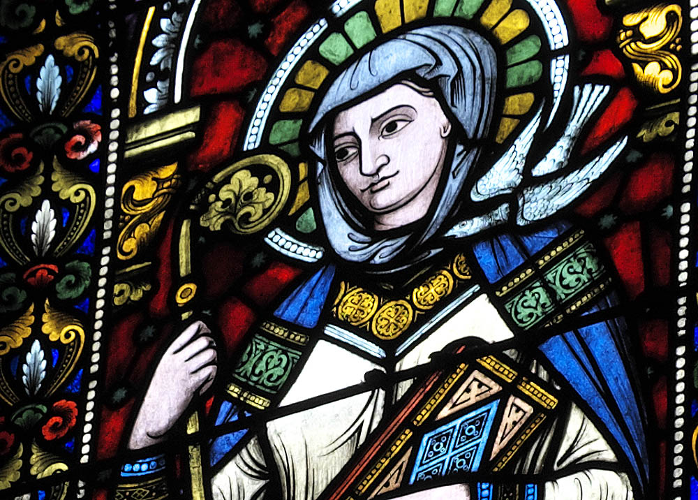 St. Scholastica, depicted in stained glass in the Church of Sainte-Foy in Sélestat, France (Wikimedia Commons/GFreihalter)