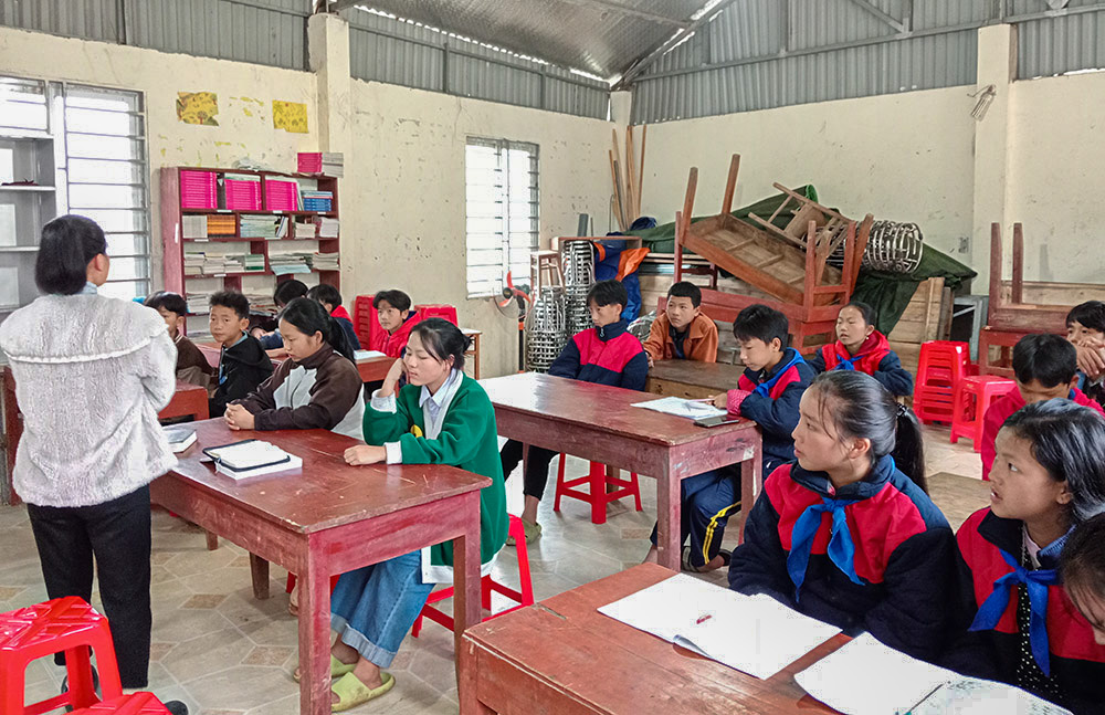 Teresa Lo Thi Dung (first row, second from right) and other students attend a class taught by Lovers of the Holy Cross Sr. Mary Tran Thi Minh at Lao Chai Church in Sa Pa, Vietnam, on Dec. 9, 2023. (Joachim Pham)