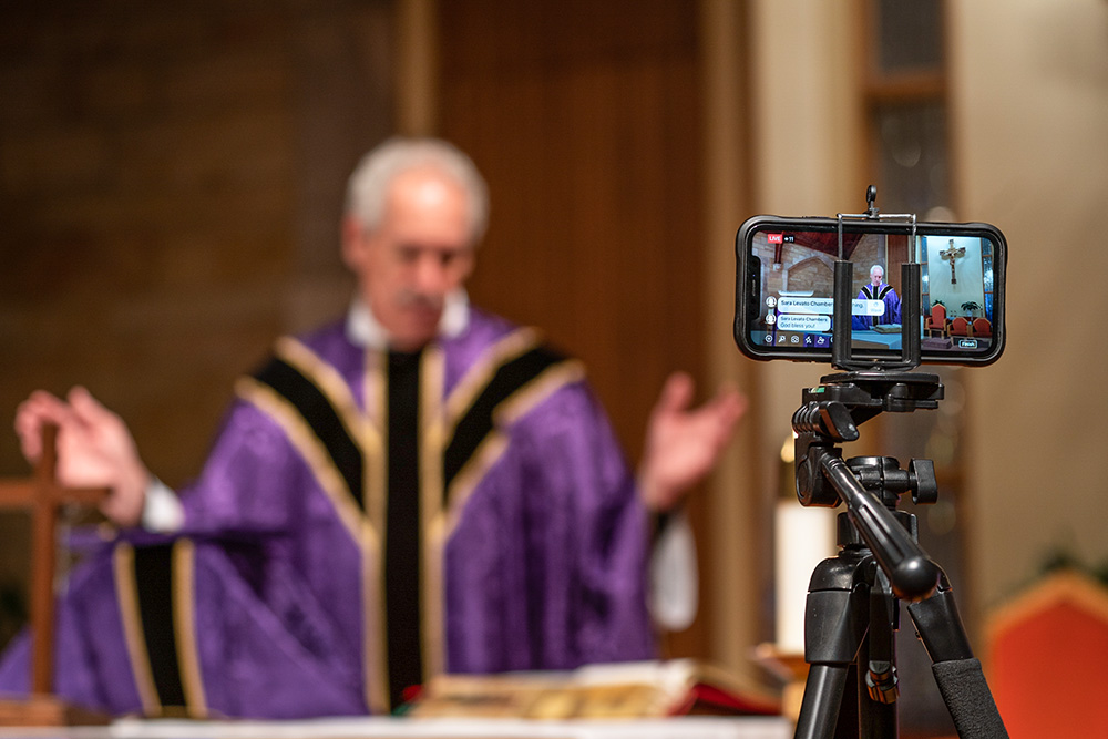 Mass is livestreamed on Facebook by Fr. Tom Kovatch at St. Charles Borromeo Catholic Church in Bloomington, Indiana, March 24, 2020, during the COVID-19 pandemic. (CNS/Katie Rutter)