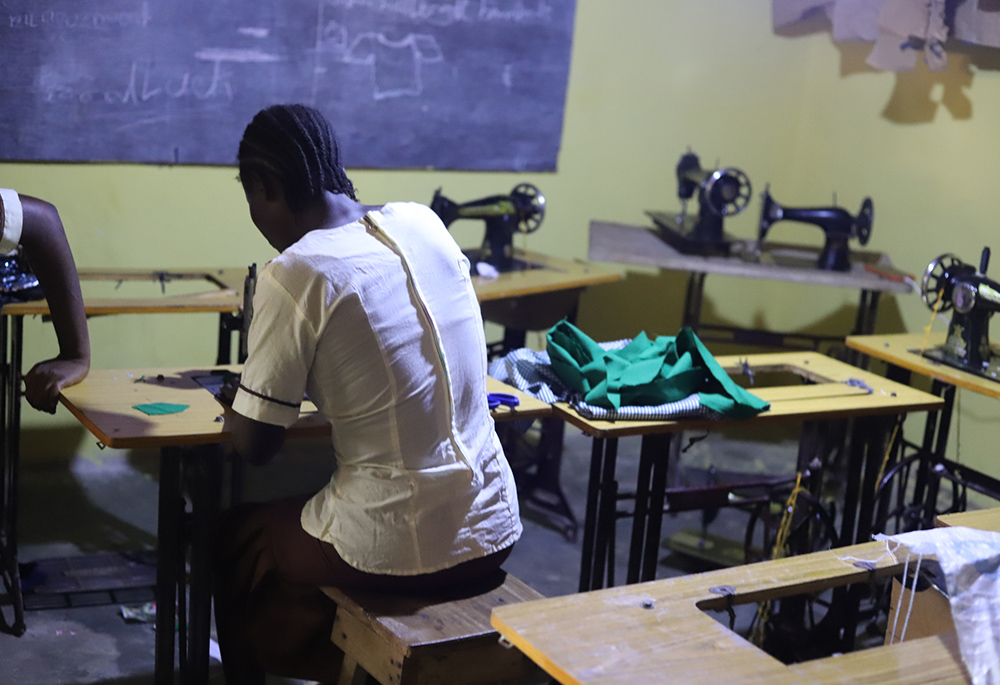 A survivor is pictured receiving training on how to sew at a Don Bosco Fambul center on September 17, 2023, in Waterloo, a southern town of Sierra Leone. The church leaders support sexual abuse survivors by offering them shelter, medical assistance, guidance, and counseling. They also provide them with sewing, catering and hairdressing skills. (GSR photo/Doreen Ajiambo)