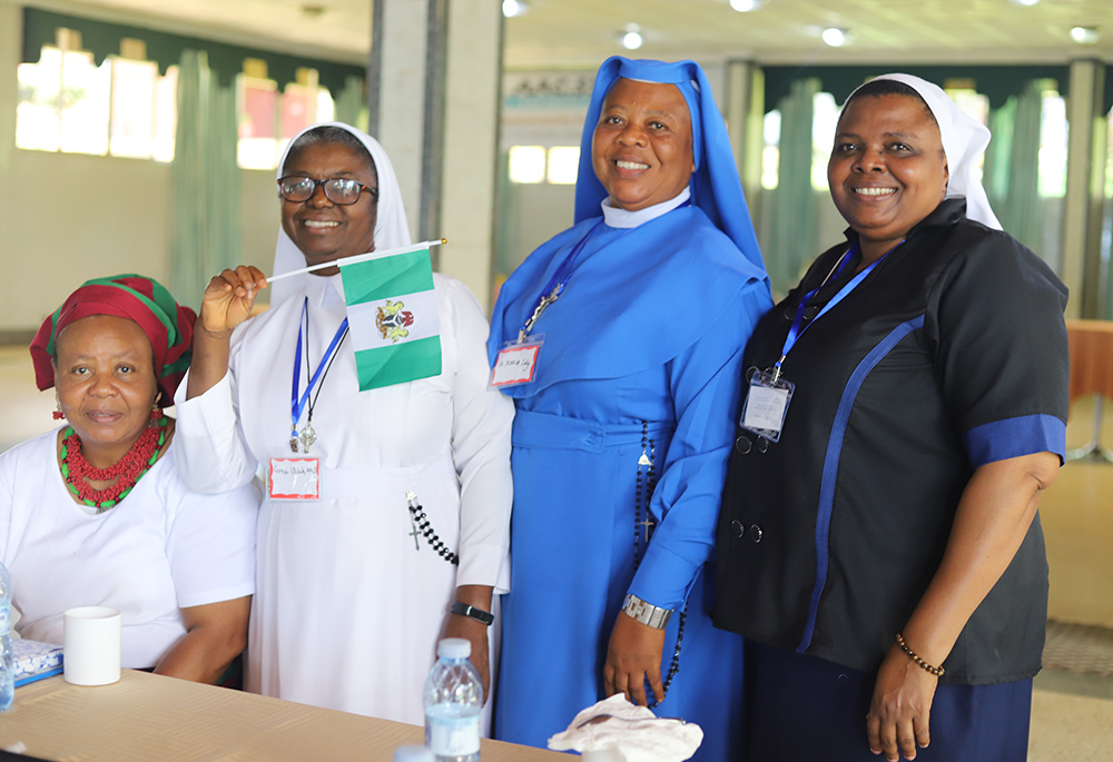 Sr. Lucy Esedebe, left, a member of the Missionary Sisters of Our Lady of the Apostles from Nigeria, and other sisters are pictured during a session at the AAC: SS convening in Uganda, April 10. (Doreen Ajiambo)