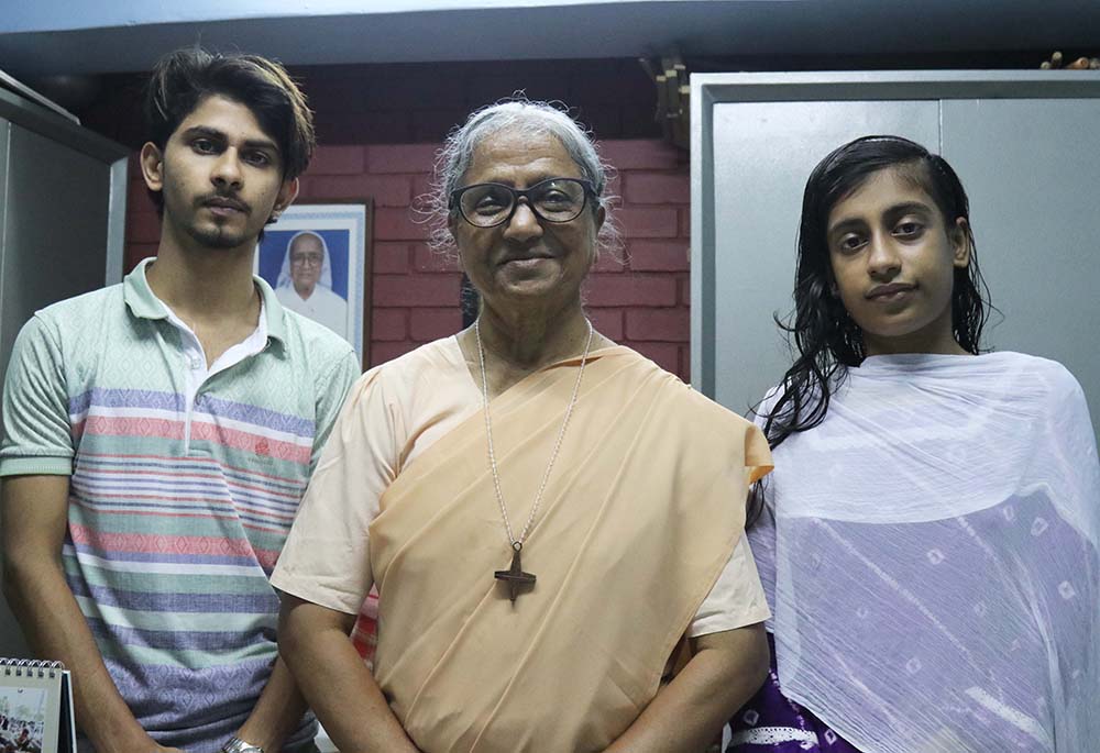 Ruksar Akhter Lily, 18, right, and Mohammad Adnan, 19, left, graduated from Green Herald Evening Charity School; they are pictured with Sr. Lourdes Mary Rozario. (Stephan Uttom Rozario)