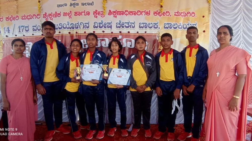 14. St. Joseph of Chambery Sr. Vijayakumari Anthony Sami (far left) and Sr. Lynette Lopes (far right) with the winners of an inter-school sports match.