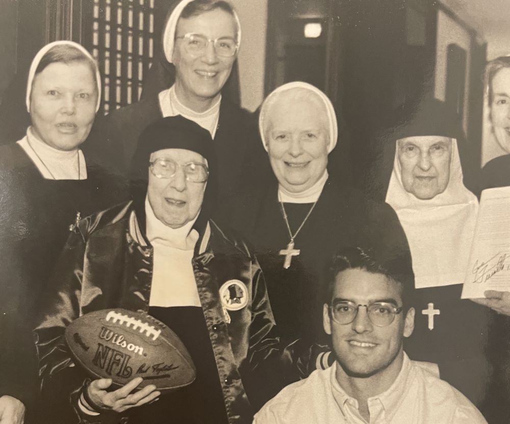 Visitation Sr. Marie Louise Kirkland holds the pigskin with Washington Redskins player Gus Frerotte on her 97th birthday in 1996. Others are (from left) Sr. Mada-anne Gell, Sr. Philomena Tisinger, Sr. Mary Berchmans Hannan and Sr. Anne Marie Di Menno.